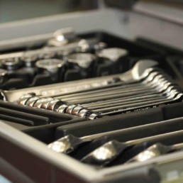 Toolkit containing spanner and socket set